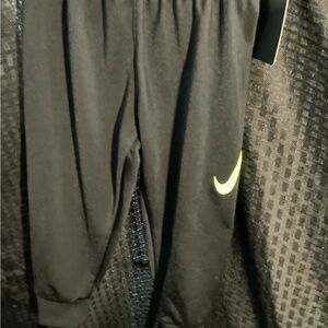 Nike Kids Black Sweatpants with Yellow Swoosh
